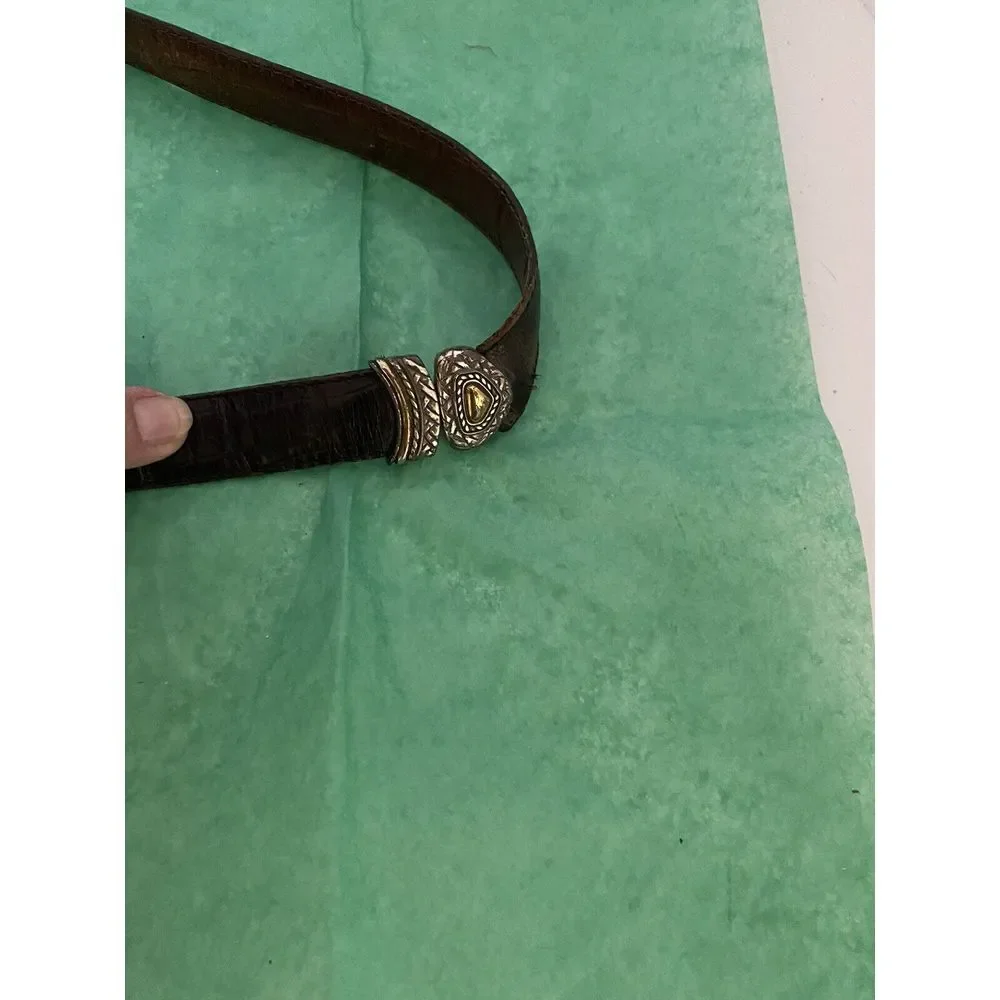 Ladies leather reversible belt black and brown with embellishments. Size med/30.